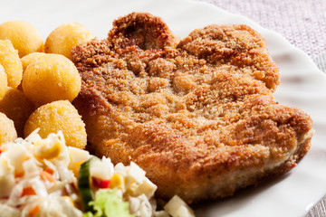 Breaded cutlet and potatoes