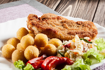 Breaded cutlet and potatoes