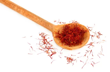 Peel and stick wall murals Herbs 2 stigmas of saffron in wooden spoon on white background close-up