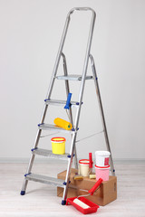 Metal ladder and paint in room