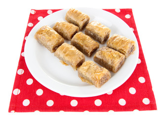 Sweet baklava on plate isolated on white