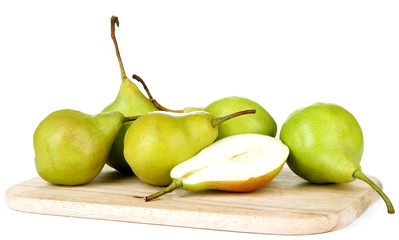 Pears on wooden cutting board, isolated on white