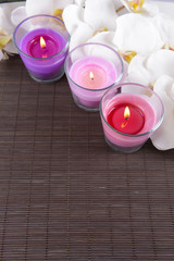 Composition with beautiful colorful candles, sea salt and