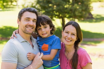 Portrait of a couple with little son at park