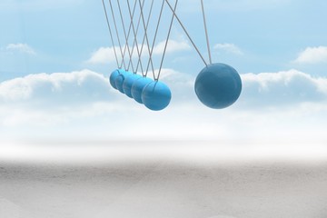 Newtons cradle above desert