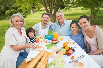 Extended family dining at outdoor table