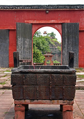 Fragment of a temple courtyard with sacrifice caldron and