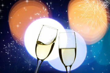 Glasses with champagne against holiday lights