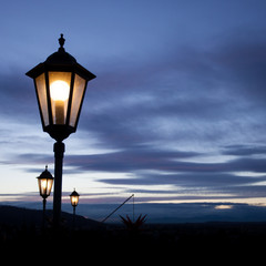 old lamp post in sunset sky