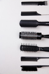 Black combs on gray background