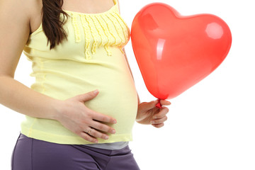 Pregnant woman holding red balloon isolated on white