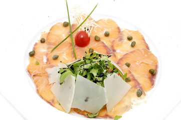 carpaccio of salmon meat with arugula and cheese
