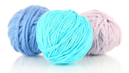 Balls of wool on wooden table background