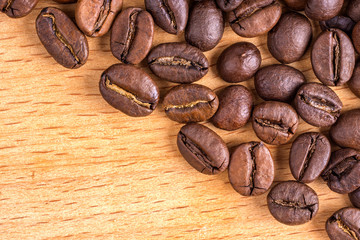 Coffee beans on wooden background