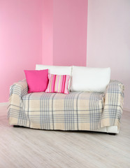 White sofa in room on pink wall background