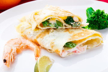 Omelet with shrimps and vegetables