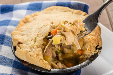 Baked turkey pot pie opened with fork
