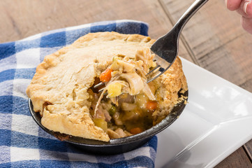 Baked turkey pot pie opened with fork