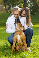 Happy Young Couple with Dog