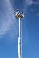 Lighting tower against a clear blue sky.