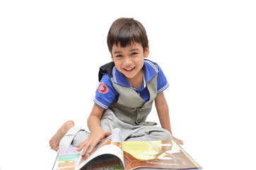 Little boy reading book