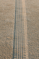 Tire track on sand.