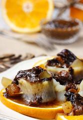 Pickled herring rolls with dried fruits and plum sauce