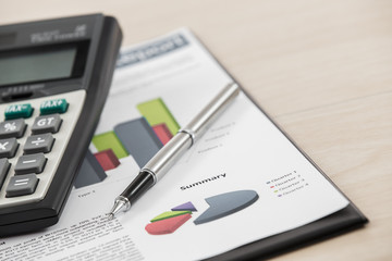 Financial graphs and charts with hourglass