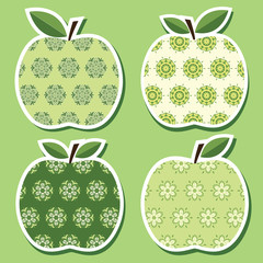 Set of four cute paper cut ornamental apples.