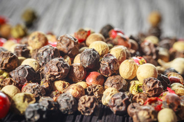pepper corns on a wooden board