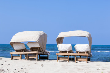 beach lounger for couples at the beach with blue sky