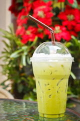 Cold milk greea tea at coffee shop