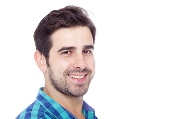 Obraz premium Close-up portrait of a handsome latin man smiling, isolated over