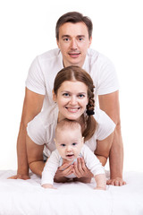 Closeup of young family with baby boy against white background
