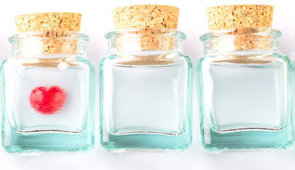 Red Valentine heart in corked bottles