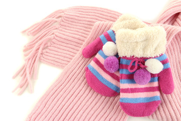 Fototapeta na wymiar Striped mittens with scarf close up