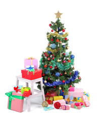 Decorated Christmas tree with gifts isolated on white