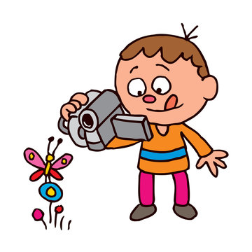 Boy filming a butterfly