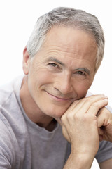 Middle-aged man sitting by pool portrait