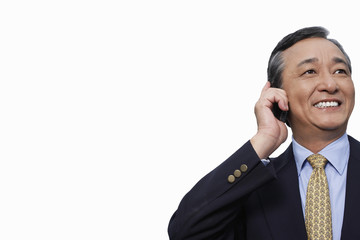 Happy businessman using cell phone over white background