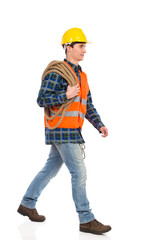 Walking construction worker with rope.