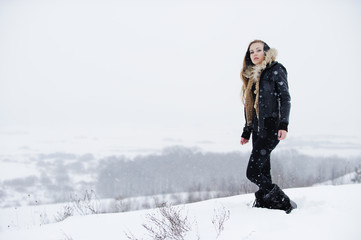 Fototapeta na wymiar Beautiful girl in white snow