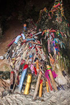 Carved wooden phalluses in Princess cave, Railay, Thailand.