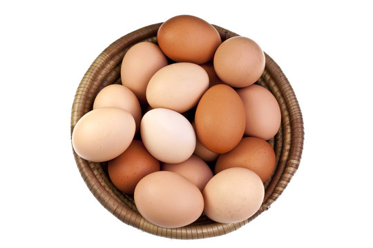 Brown eggs in a woven bowl