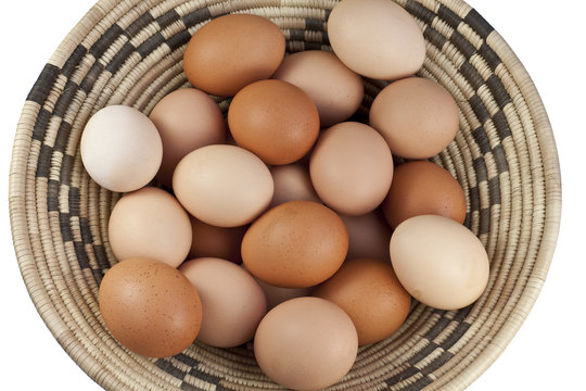 Brown eggs in a woven bowl