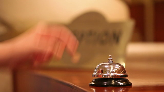 call at old hotel bell on a wood stand