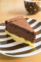 Chocolate cheesecake on a strip plate.