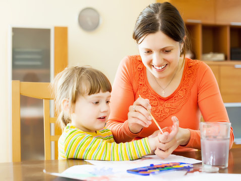 Happy Mother And  Child Drawing  With Hands And Watercolor