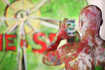 Bald man in the paint all photographs on your phone painted wall