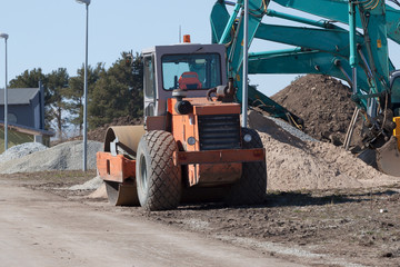 Excavators and asphalt compactor truck